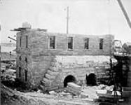 Construction of the canal. View of west side of power house, Sault Ste. Marie canal 1887-1895, May 24 1894