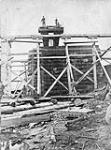 Construction of the Miramichi Bridges on the Intercolonial Railway. Southwest Branch. Side view of westerly abutment, with gantrey staging and traveller/Construction des ponts de Miramichi sur l'Intercolonial. Embranchement sud-ouest 1872-1874