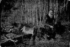 Mr. Walter Barrie, Homewood, Man., with dead timber wolf n.d.