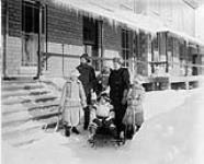 Lord and Lady Aberdeen and family. L. to R.: Dudley Gordon, Lord Aberdeen, Marjorie Gordon, Lady Aberdeen, Haddo Gordon (on sleigh), and Archie Gordon Jan. 1894