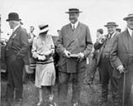 Sir Henry Thornton and Lady Thornton with Rt. Hon. George P. Graham, Mr. Walter Thompson and Mr. Gordon Edwards, M.P., on the edge of the flying field July 1927