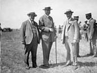 [Sir Henry Thornton (centre) on the edge of the flying field, near the Ottawa Hunt Club, awaiting Charles Lindbergh's arrival for the Jubilee Celebrations] July 1927