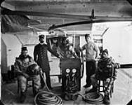 Diving party of H.M.S. BLAKE (1893-1895), flagship of North America and West Indies Squadron. Munton's Group Divers [ca. 1893].
