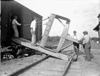 (Relief Projects - No. 11). Unloading a scraper Aug. 1935