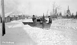 (Relief Projects - No. 20). Snowplough clearing the road Dec. 1933