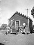 (Relief Projects - No. 21). Painting the Picquet Building at H.Q. M.D. 10 Aug. 1934