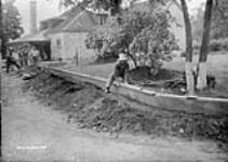 (Relief Projects - No. 27). Concrete curb on the south side of the Officers' Mess June 1933