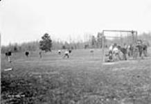 (Relief Projects - No. 30). Softball game between [camps] 30 and 30B May 1933