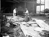 (Relief Projects - No. 30). Laying a flagstone walk to the Officers' Mess, RCAF Sept. 1934