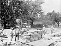 (Relief Projects - No. 37). RMC pouring concrete for the lecture room to the Physics Labratory June 1933