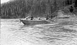 Indians with Moose skin boat 1908