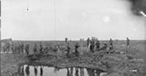 German prisoners and wounded Canadians, Battle of Passchendaele, November, 1917 November, 1917.
