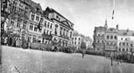 General view of Grand Place, Mons, [Belgium], showing General Horne inspecting 7th Canadian Infantry Brigade. Nov. 15th, 1918 Nov. 15, 1918.