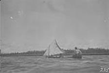 Canoeing under sail, Whitefish Lake, Sask