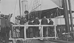 His Excellency [Earl Grey] going aboard Lady Northcliffe's yacht [at Grand Falls, Nfld.]