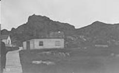 His Excellency [Earl Grey] and party on rock behind hospital, Indian Harbour, [Labrador] n.d.