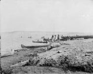Indians arriving at Fort Simpson, [N.W.T.] at the confluence of Laird and Mackenzie Rivers