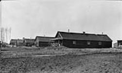 (Left to right): Troop's Hospitals; Officer's Hospital; No. 1 Barracks; No. 2 Barracks; and Dining Hall, [of an internment camp] ca. 1915 - 1918