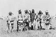 Members of the Brave Dog Society. 1. Getting Up. 2. White Headed Chief. 3. Setting Eagle. 4. Frank Rye Eater. 5. Bear Robe. 6. Eagle Speaker