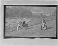 [Children playing on hill] n.d.