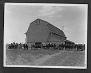 Work horses and attendants standing outside the Asylum Farm barn 191-?