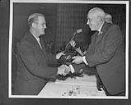 Bill Durnan being inducted into the Hockey Hall of Fame by Clarence Campbell n.d.