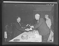 Maurice Richard "Rocket" being inducted into the Hockey Hall of Fame by Clarence Campbell in 1961 1961