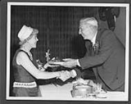 Harry Price inducting Mrs. June Bell Walker into the Canadian Sports Hall of Fame. 1962 1962