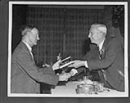 George Goulding (left) being inducted into the Sports Hall of Fame by Harry Price. 1962 1962