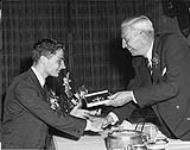 [Donald Jackson (left) being inducted into the Canadian Sports Hall of Fame by Harry Price. 1962] 1962