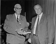 [Harry Price (left) and R.W. Porter at the Canadian Sports Hall of Fame luncheon. 1969.] 1969