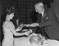 [Frances Dafoe Melnick being inducted into the Canadian Sports Hall of Fame by Harry Price, 1962.] 1962
