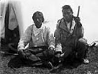 Two Métis men sitting outside a tent in Maple Creek, Sask. 1884 1884.