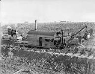 View of steam shovel from North Bank with locomotive and other rolling stock in background October 5, 1895.