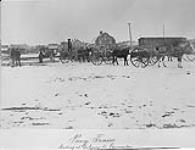 Pony train loading at Calgary for Edmonton, Alta 1886.