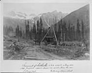 Summit of Selkirks, looking East, C.P.R. (Canadian Pacific Railway), 4300 ft. above sea Mt. Tupper 4983 ft. above C.P.R. (Canadian Pacific Railway), 9063 ft. above the sea. Unloading steam shovel 1886
