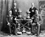 Curling champions of Walkerville, 1894 are: D. Stewart, J. Rochon, A. Hodgson, and W.H. Whalen 1894