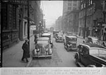 Traffic on Adelaide Street looking east from 100 ft. east of Yonge Street, [Toronto, Ont.] 1:10 p.m. Sat Dec 21,1935