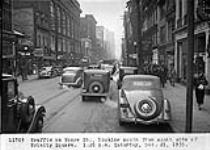 Traffic on Yonge Street, looking south, from south side of Trinity Square, [Toronto, Ont.] 1:20 p.m. Sat.Dec.21,1935