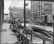 [Repairing street car tracks in downtown Toronto, Ontario, c. 1935] [ca. 1935]