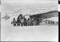 (Hudson Strait Expedition) Personnel of Base 'A' with Fokker 'Universal' aircraft G-CAHH 'British Columbia'. (L. to R.): Sgt. Hall, RCCS, F/L F.S. Coghill, Cpt. Kirkaldy, Cpt. Torrie, Capt. P. Semple Feb 1928