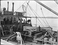 (Hudson Strait Expedition) Unloading pontoon for Fokker 'Universal' aircraft from C.G.S. Stanley at Base 'B' Aug. 1927