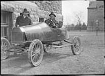 [Students with home-built car, Queen's University, Kingston, Ont., c. 1916.] 1916
