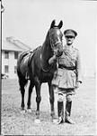 Lieutenant-Colonel R.S. Timmis, Royal Canadian Dragoons with "Lady Jane", Stanley Barracks 28 Oct. 1935