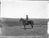 Reginald S. Timmis riding "Tommy" Trochu Valley 20 Oct. 1907