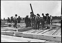 Leckie's barn raising. Putting, a bent together June 2, 1908