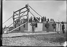 Leckies' barn raising. The first bent is in place June 1908