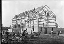 Leckies' barn raising. Barn completed in frame June, 1908