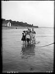 Group of children on raft, Lake Huron Park, [Ont.], 1907 1907