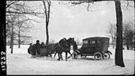 Team and cutter passing motorist in High Park 27 Dec. 1914
